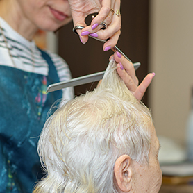 resident having their haircut